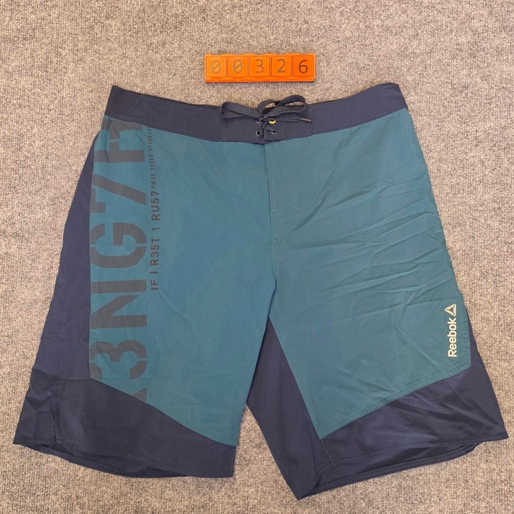 Reebok Board Shorts Mens Large Blue & Green Colorblock with Gray Text.